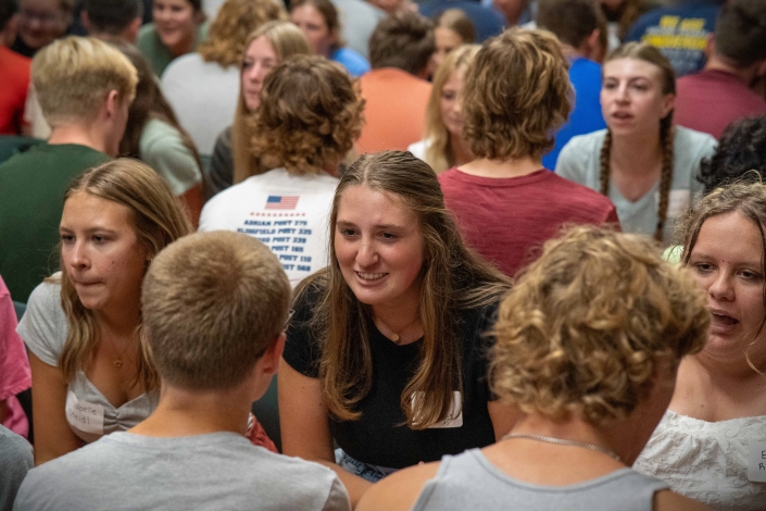 Students talking to each other across the tables