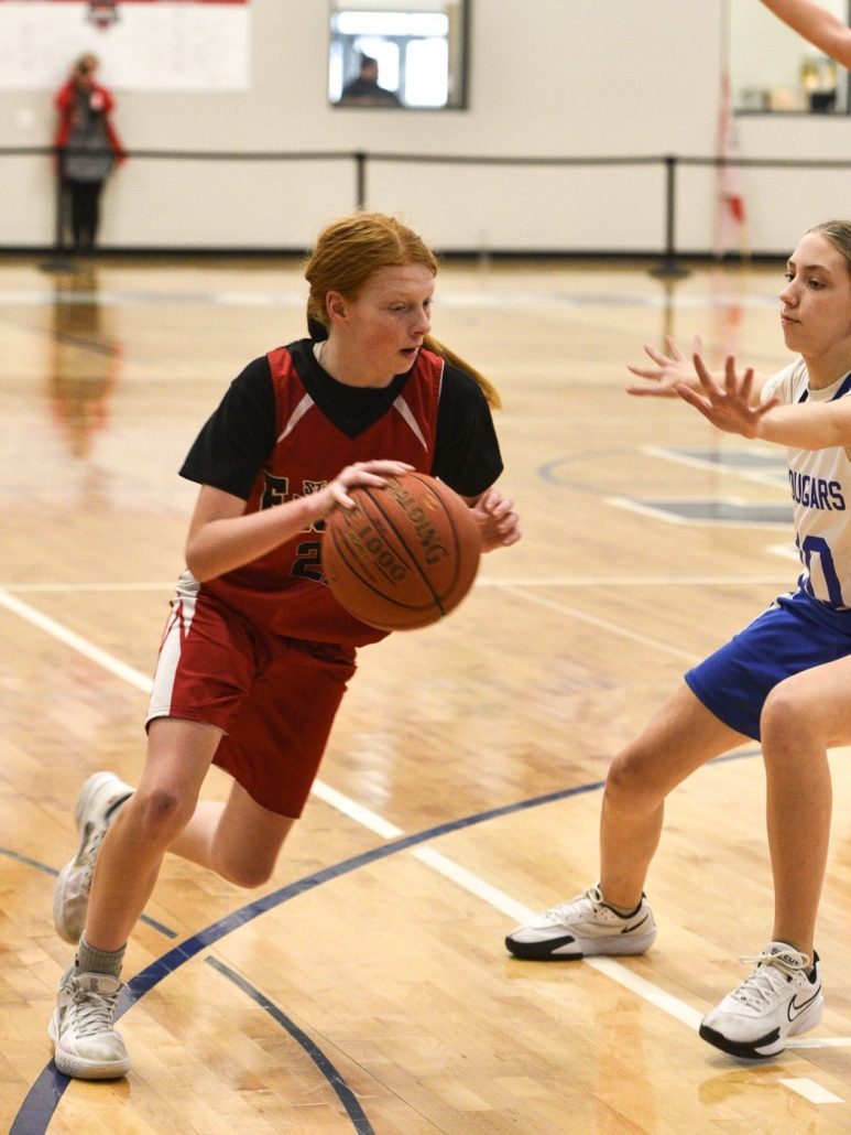 Girl dribbling a basketball