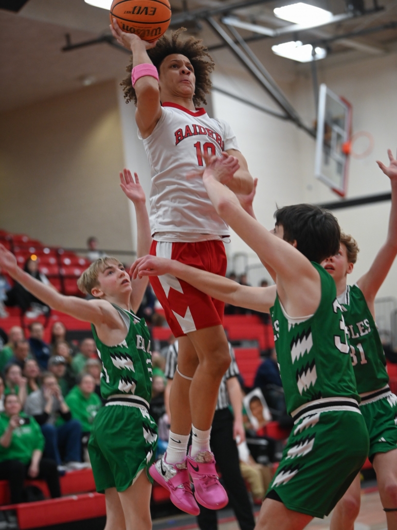 Boy shooting basketball