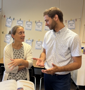 Principal Mitchell Giovannettone consulting with a teacher