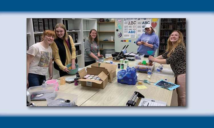 Students at a work table.