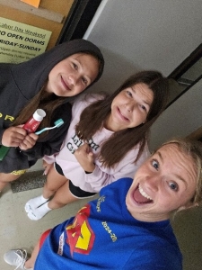 Aubrey Bode taking a selfie with other students.
