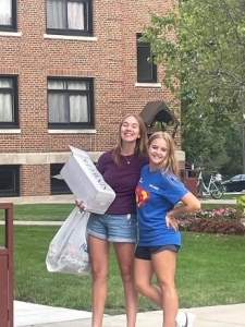 Alexandra Schroeder and a student posing for a photo. 