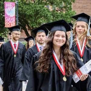 2025 Graduates walking outside